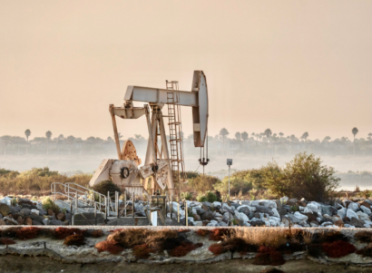 Oil jack during a hazy morning sunrise California.