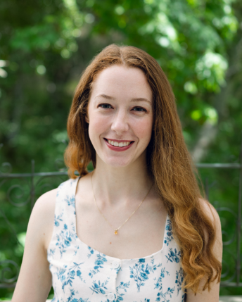 Person with a green leafy background